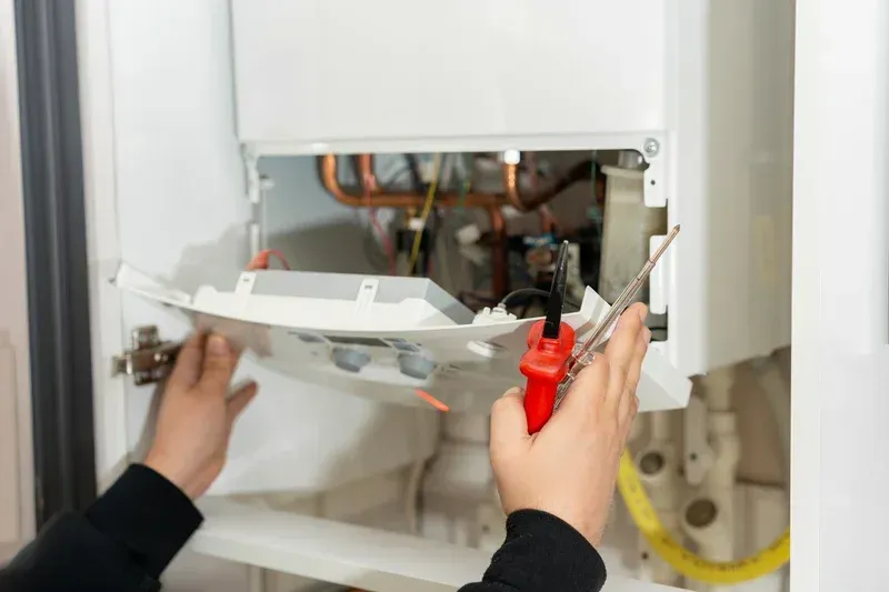 Loving Air technician performing HVAC repair and maintenance in Fredericksburg VA